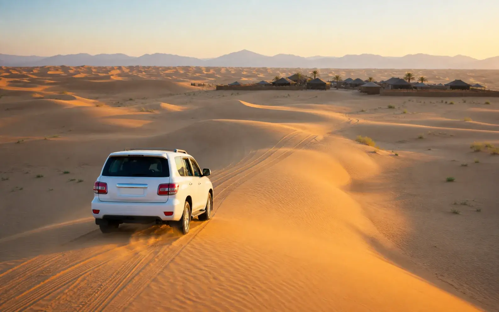 4×4 crossing the dunes in afternoon light