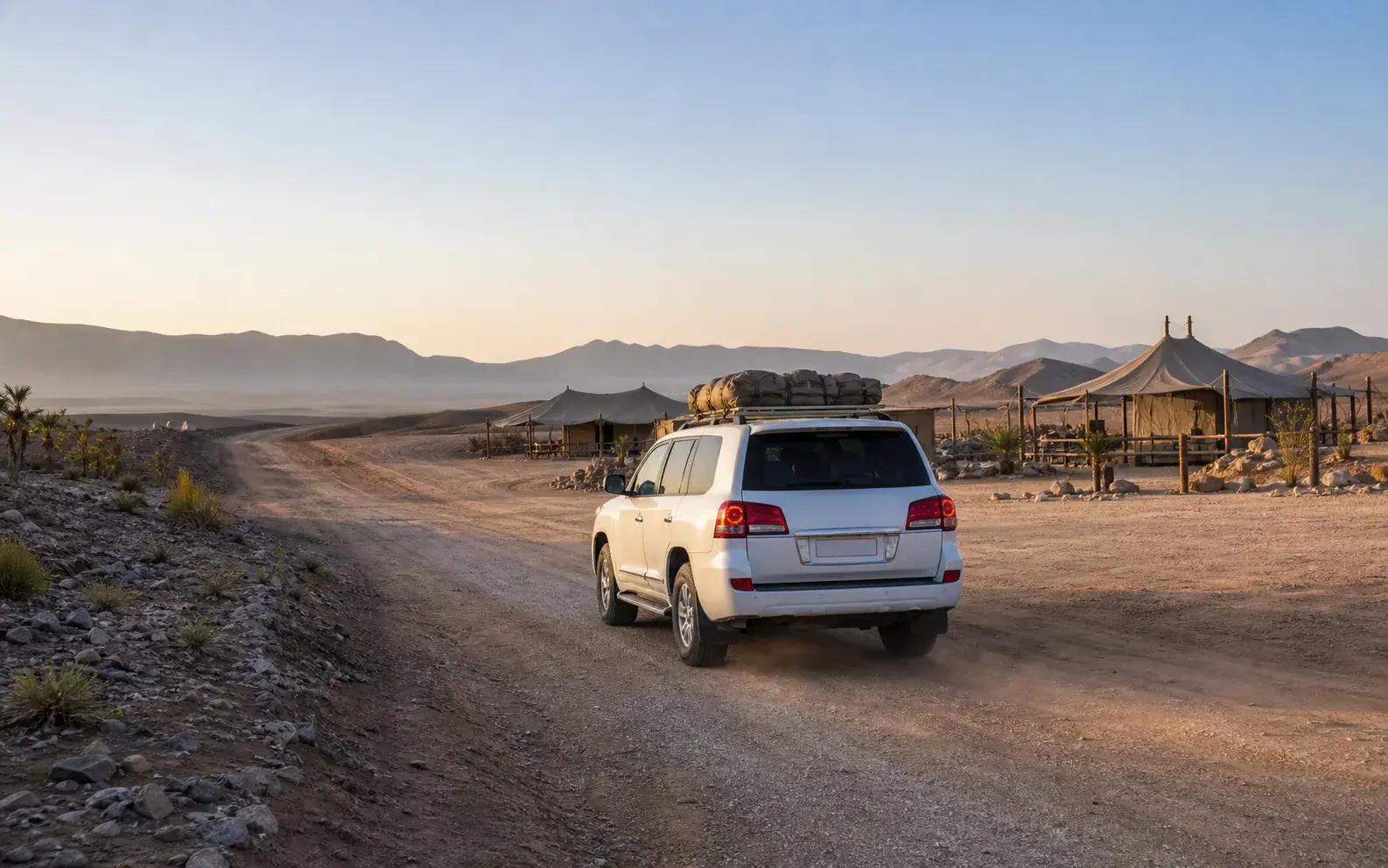 Overnight safari vehicle leaving the desert for the morning return to Dubai