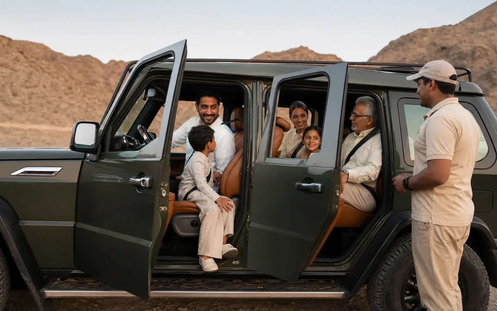 A family seated in their private 4×4